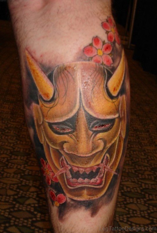 Oni Mask Tattoo On Back Leg