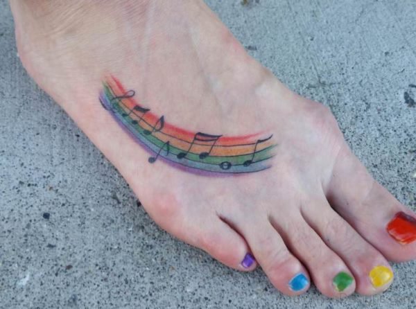 Rainbow Musical Tattoo On Foot 