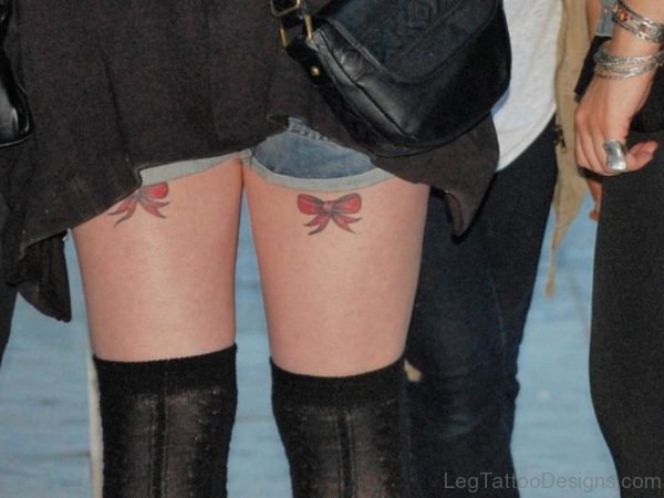 Red Bow Tattoo On Thigh