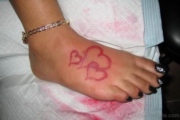 Red Ink Heart Tattoo