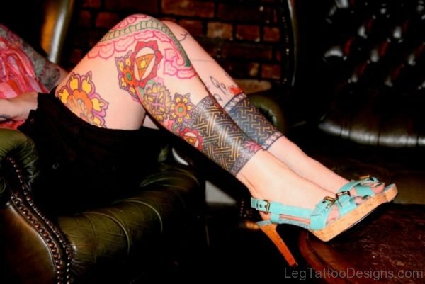 Red Ink Tribal Tattoo On Leg