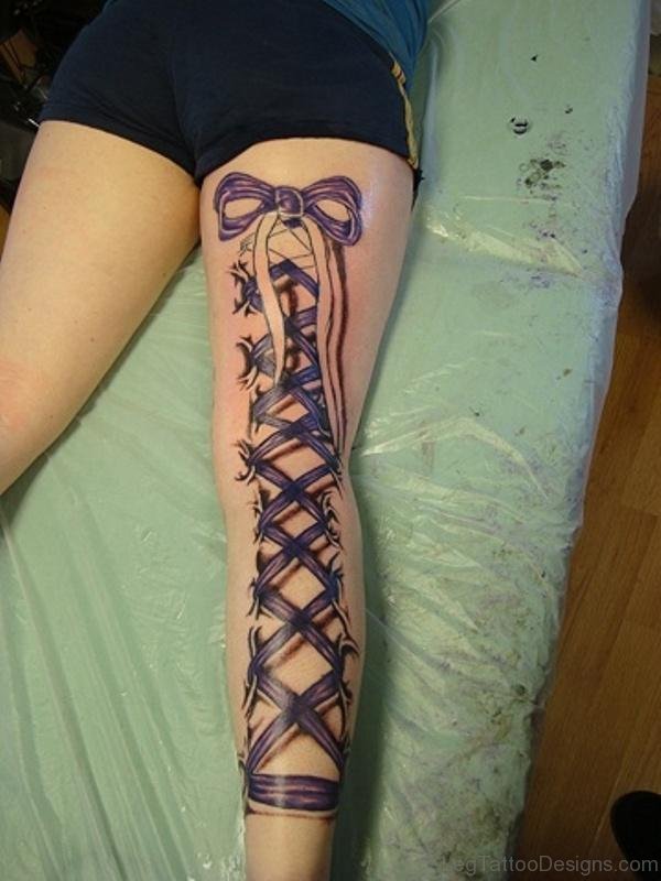 Ribbon Corset Bow Tattoo On Thigh