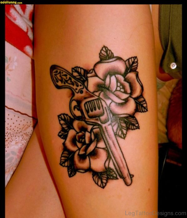 Rose And Gun Tattoo On Thigh