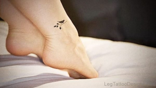 Small Black Bird Tattoo