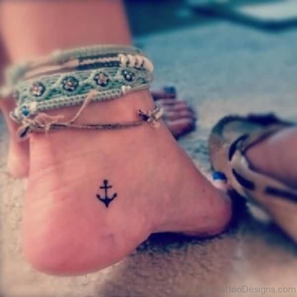 Tiny Black Anchor Tattoo On Ankle
