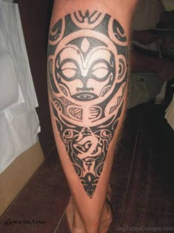 Tribal Mask Tattoo On Lower Leg