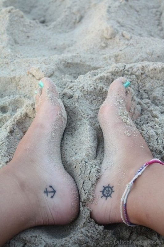 Wheel And Anchor Tattoo On Ankle