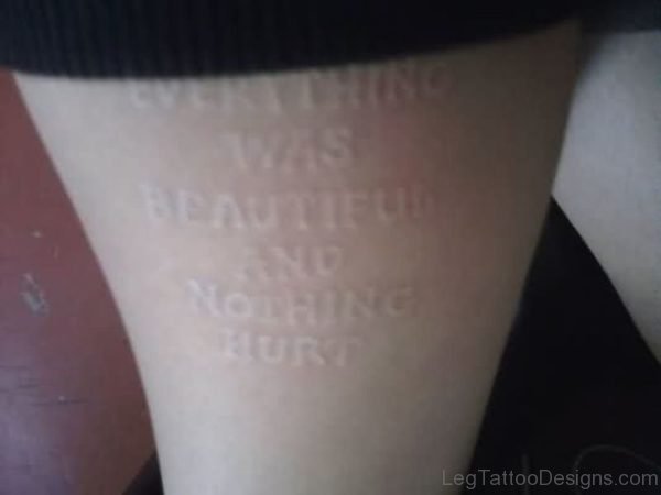 White Ink Wording Tattoo On Thigh