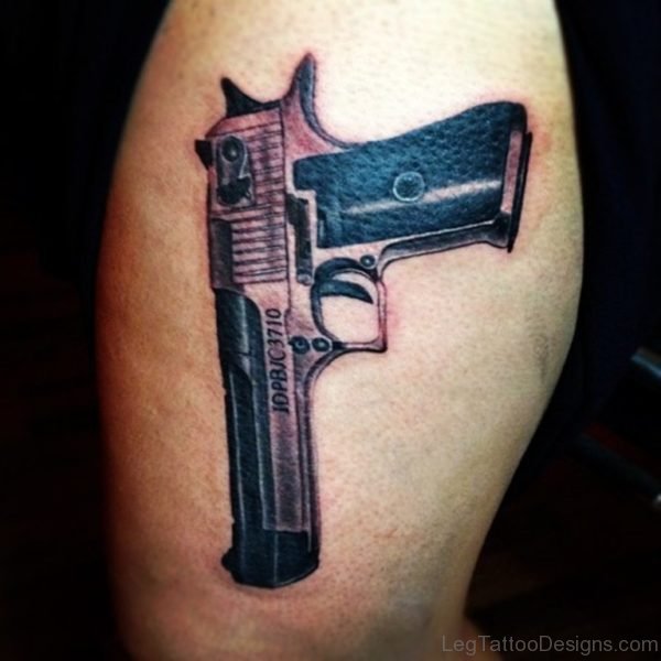 Wonderful Gun Tattoo On Thigh