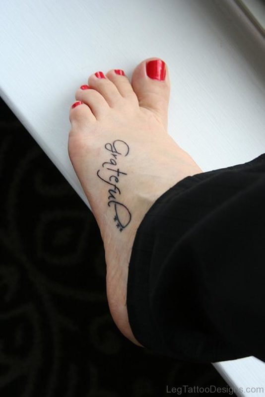Word Tattoo On Foot 